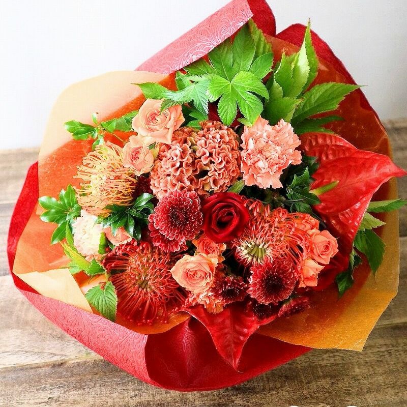 オレンジ色と赤色の花束、おしゃれなアレンジメント。会社のお祝い・記念日に喜ばれるお花のギフト