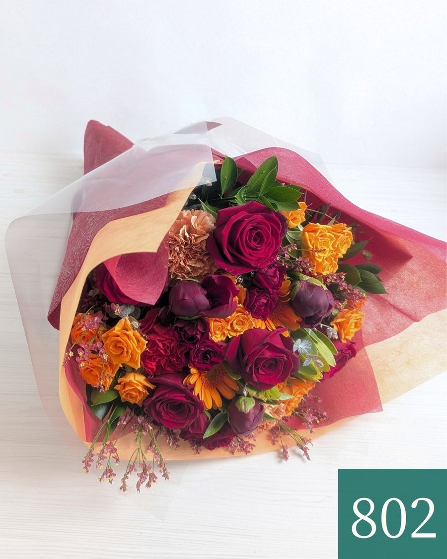 男性の誕生日に贈る、赤オレンジ「クリムゾン」の花束